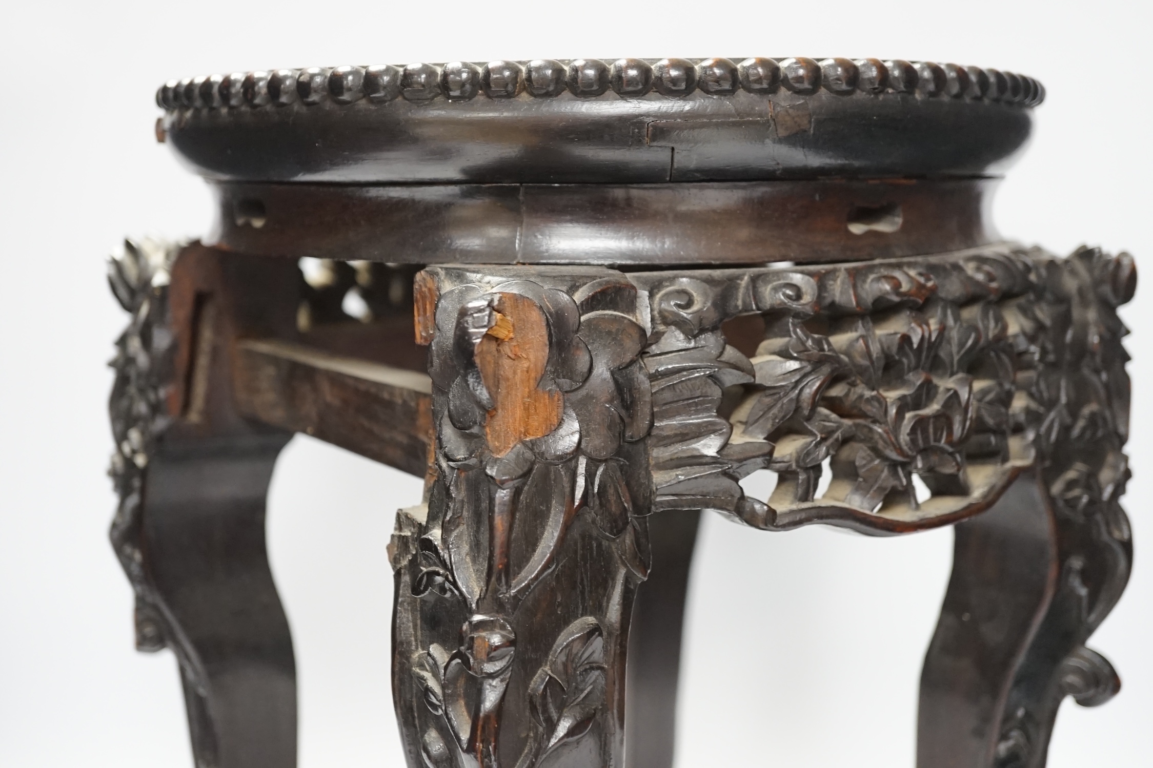 A Chinese hongmu stand, with inset marble top, 42cm high. Condition - poor to fair, section of frieze missing